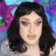 A screenshot from a Pride Month Zoom event featuring the drag queen Coleslaw.